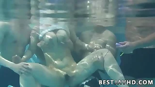 Suzuna Komiya&comma; the nastiest Asian woman&comma; gives fellatio by the pool in the greatest Japanese group fuck-a-thon scene&period;